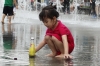 Children play in the fountain in front of Statue of King Sejong the Great in Gwanghwamun Square, Seoul KR