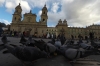 Feeding pigeons in Plaza Bolivar, Bogotá CO