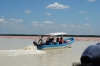 Flamingoes and tourist boats on Ria Celestun