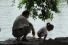 Young children playing beside the lake in Guilin, China