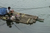 Fishing from a bamboo raft on the Li River near Elephant Trunk Hill, Guilin, China