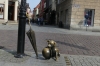 Small statue of the comic-strip dog Filuś with his owner Professor Filutek’s umbrella, Toruń PL