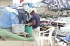 Fisherman mending his nets, Miraflores, Lima PE