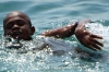 Young boys swimming in the harbour, Zanzibar, Tanzania