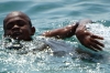 Young boys swimming in the harbour, Zanzibar, Tanzania Young boys swimming in the harbour, Zanzibar, Tanzania